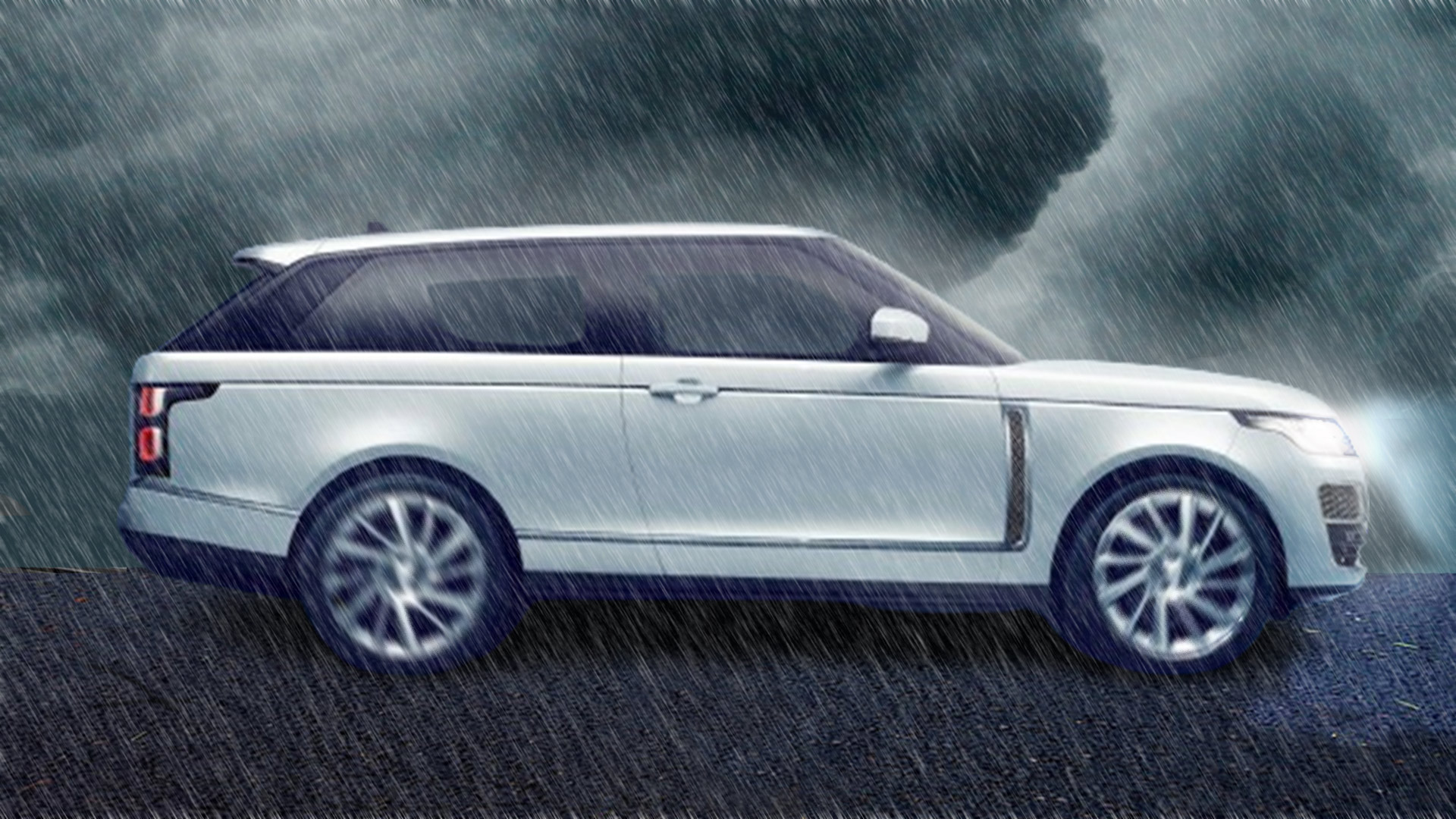 White range rover driving in a hail storm with dark ominous storm clouds